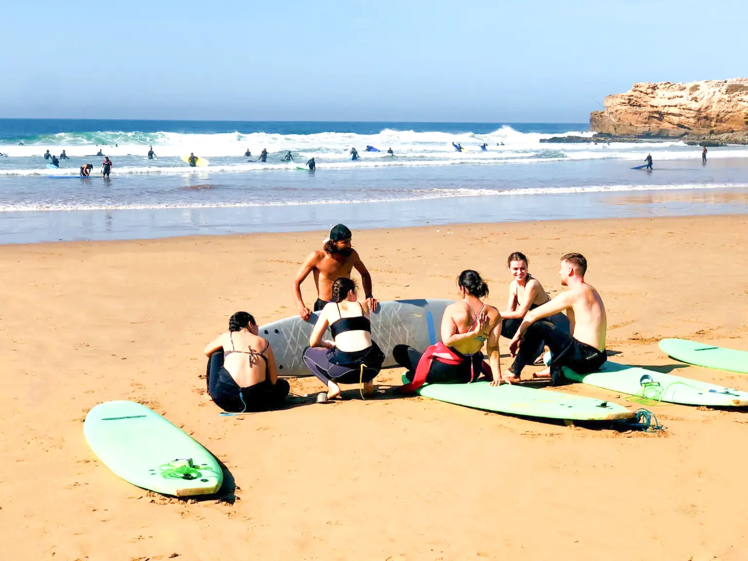 Vibe Surf Morocco surf lesson on a sunny beach near Tamraght