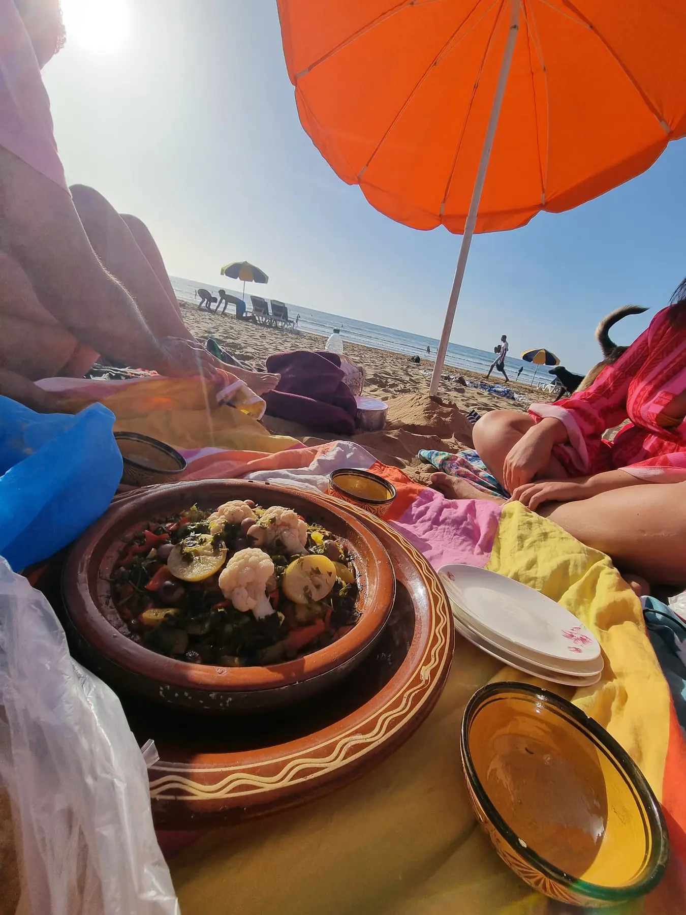 Beach picnic with Moroccan tagine after surfing