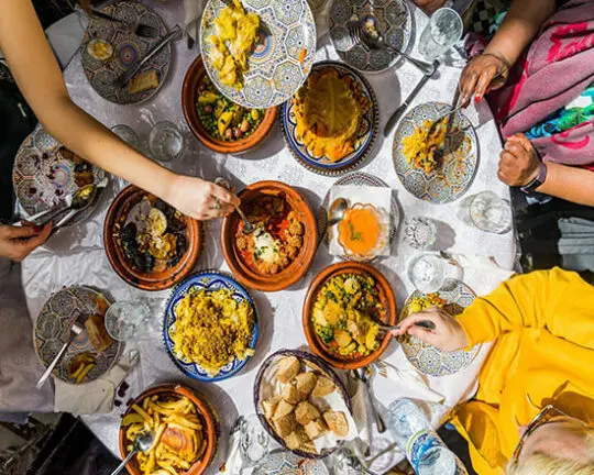 Guests sharing a colourful Moroccan meal