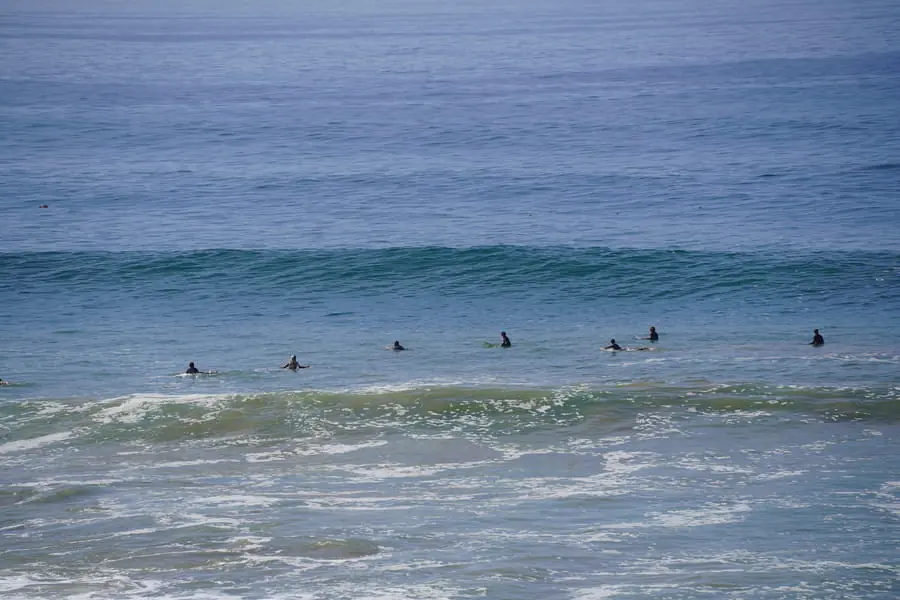 Surfers waiting together in the Atlantic lineup
