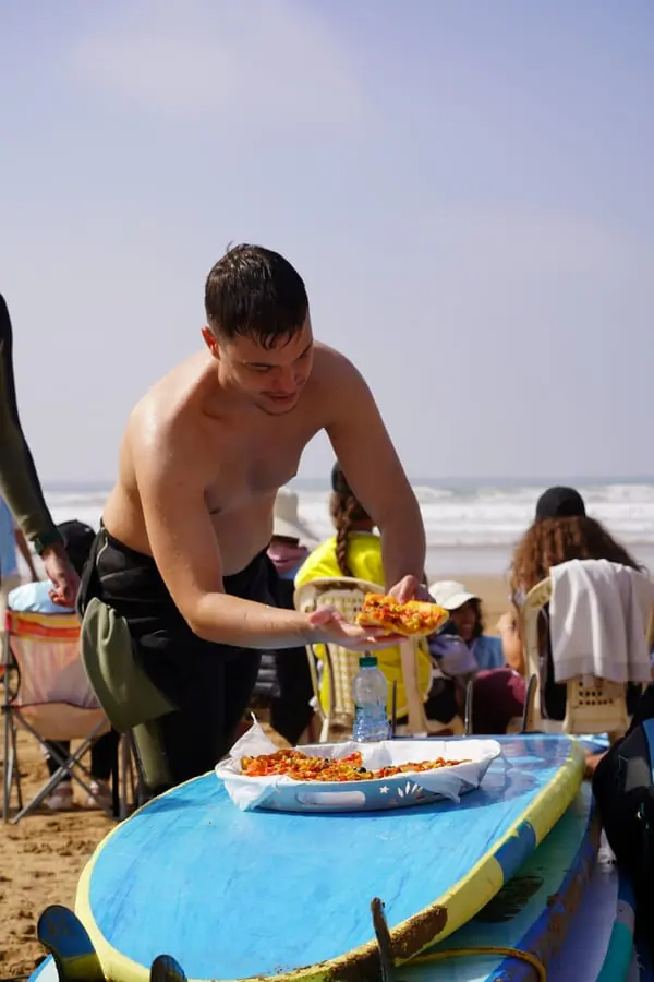 Fresh fruit and lunch served beside the surfboards